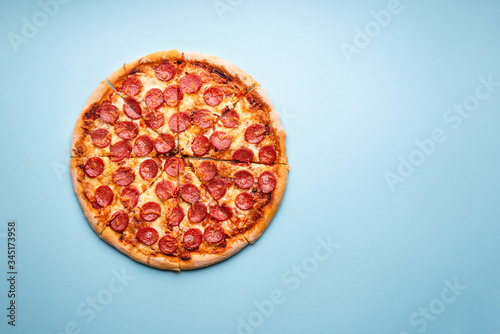 Sliced pizza flat lay. Hot pepperoni pizza