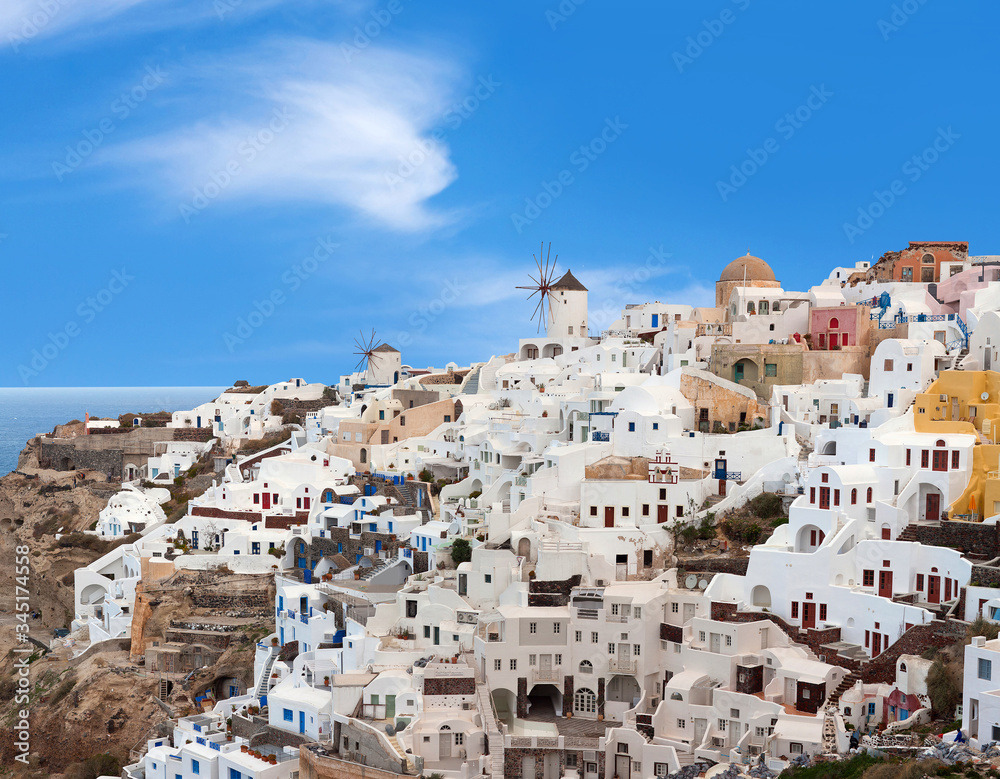 Panoramic view of Oia town at sunset, Santorini island, Cyclades, Greece