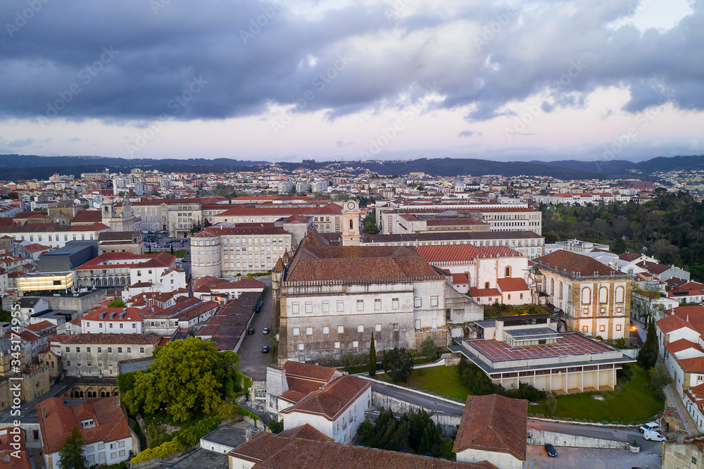 Coimbra drone aerial of beautiful buildings university at sunset, in Portugal