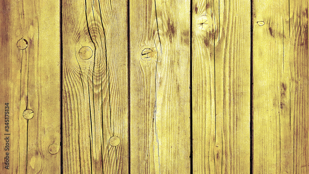 Naklejka premium Yellow background wooden planks board texture.