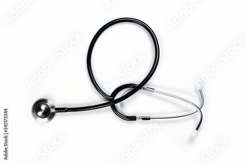Medical stethoscope  the black phonendoscope  close up on white background 