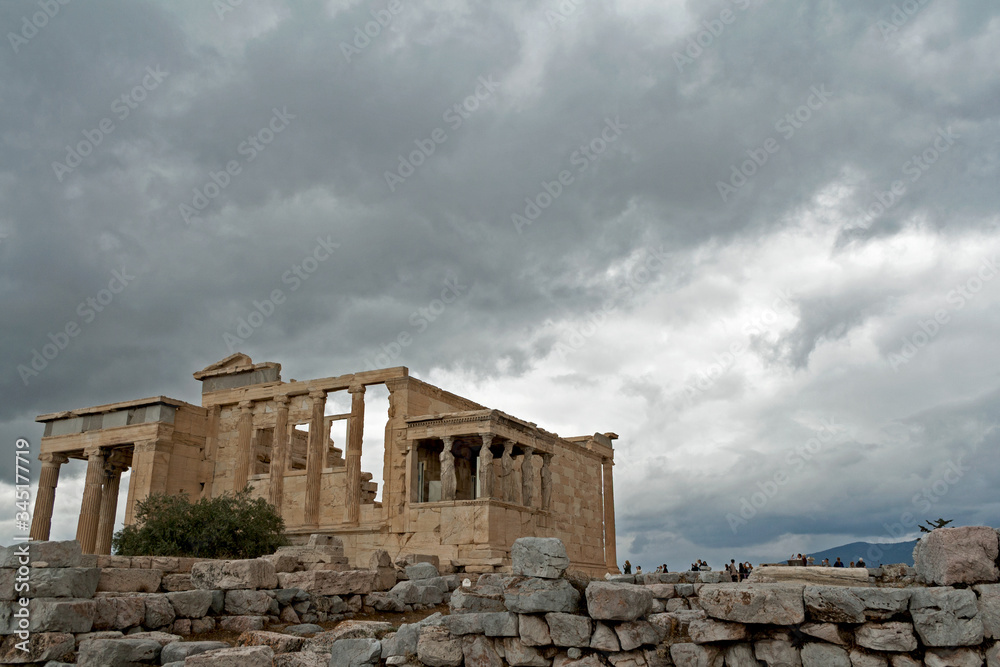 Temple Erechtheion with the famous porch of the caryatids instead of columns in the Acropolis