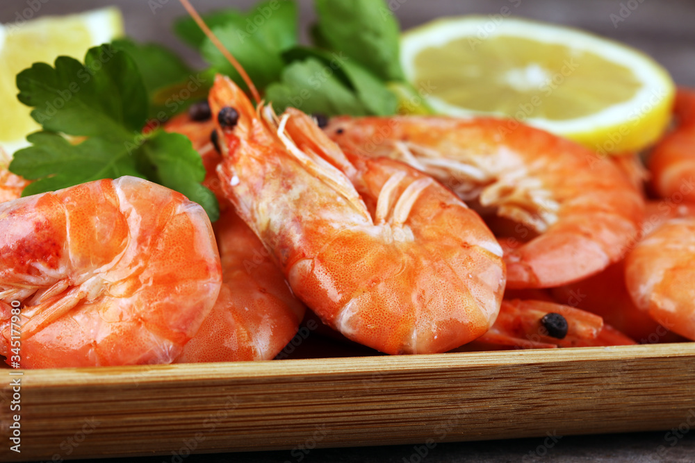 Raw fresh Prawns Langostino Austral. shrimp seafood with lemon and spices on background Raw fresh Prawns Langostino Austral. shrimp seafood with lemon and spices on background