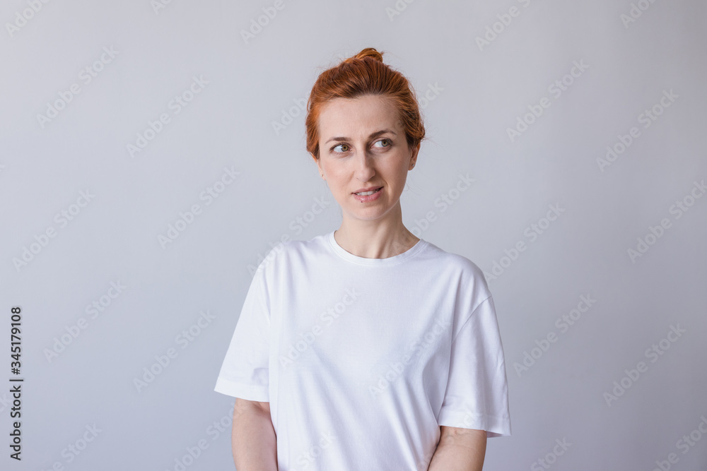 Headshot Portrait of happy ginger girl with freckles smiling . White background. Headshot Portrait of happy ginger girl with freckles smiling . White background.