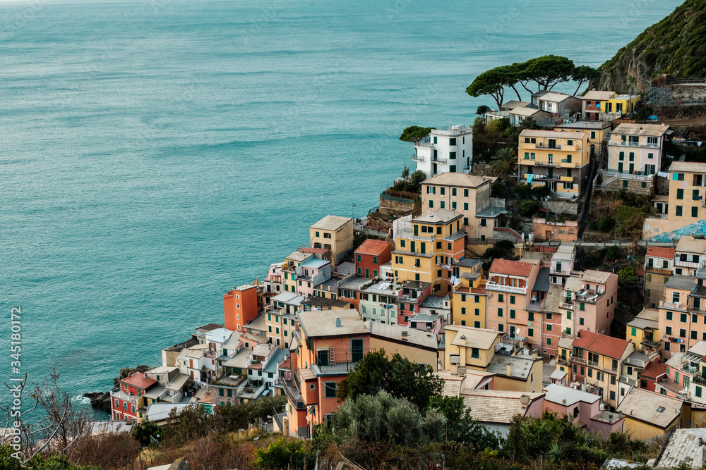 View of Riomaggiore from the top of the hill. Old village of Cinque Terre National Park in Liguria, Italy