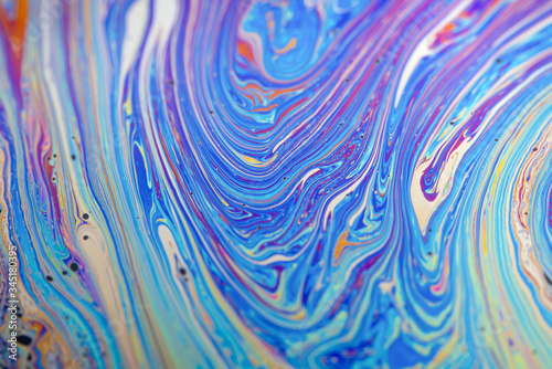 Close up soap bubble background. Psychedelic abstract background in blue tones Marble color effect