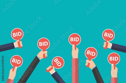 Hands holding auction paddle isolated on blue background. Auction and bidding sale process concept