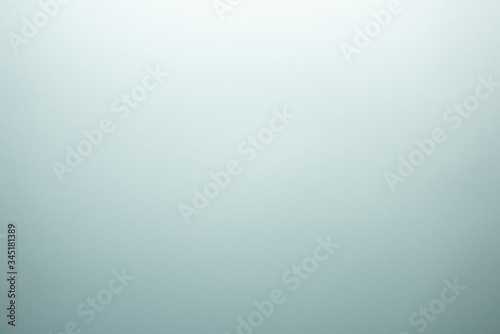 Light turquoise background with gradient.