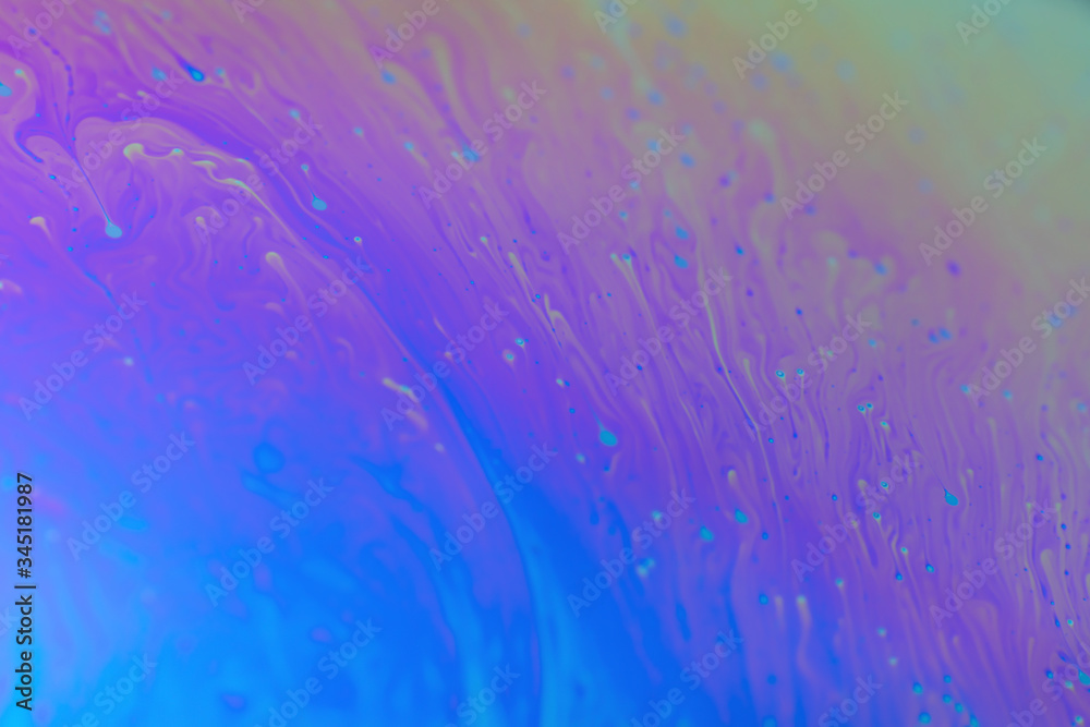 Psychedelic background made by light on the surface of a soap bubble