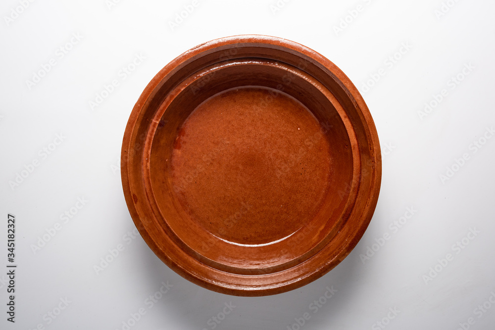 Empty clay plate top view Empty clay plate top view