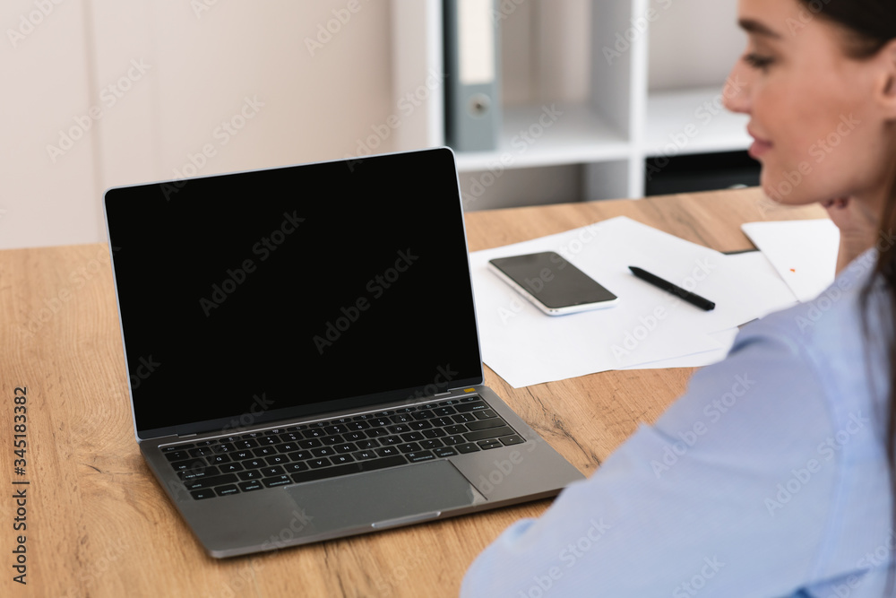 Businesswoman Sitting At Laptop With Blank Screen Working In Office Businesswoman Sitting At Laptop With Blank Screen Working In Office