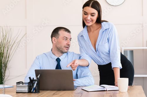 Canvastavla Lustful Businessman Looking At Secretary Girl's Breast Sitting In Office