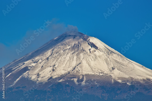 snowy popocatepetl volcano with blue sky