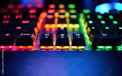 Premium Gaming RGB LED backlit keyboard. Mostly red, orange and green. Front view.