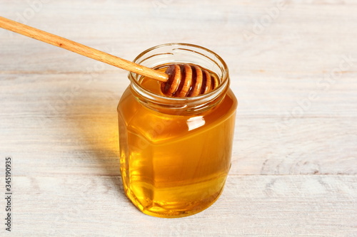 Jar of Honey with Honey Dipper photo