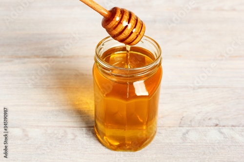 Jar of Honey with Honey Dipper photo