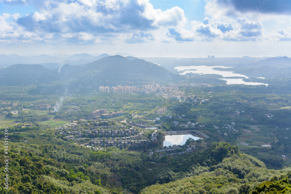 Panoramic view to mountains, tropical forest, Yanoda Park and Sanya city. Rainforest cultural tourism zone Yanoda, Hainan, China.