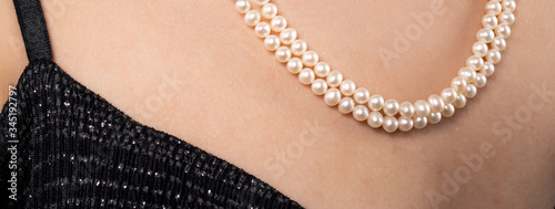 woman wearing pearl diamond necklace
