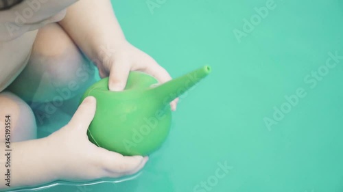 Rubber enema in the hands