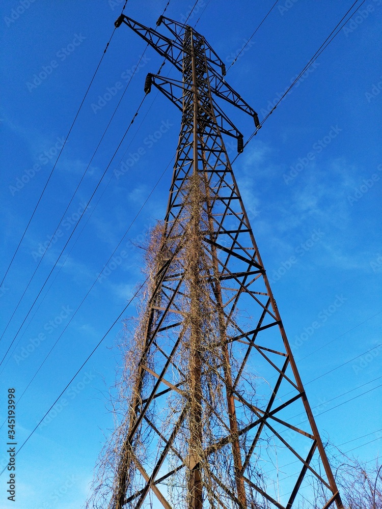 Very high metal electric pole with wires. Very high metal electric pole with wires.