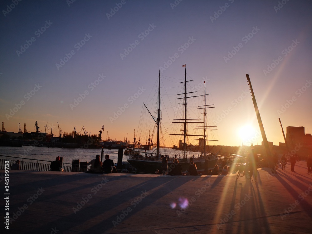 sunset and boat in elbe river port Germany Hamburg
