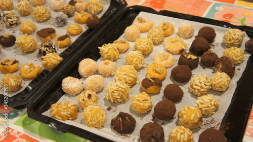 Real homemade sweet Spanish dessert panallets traditional for the Halloween all Saint Day in Catalonia. photo