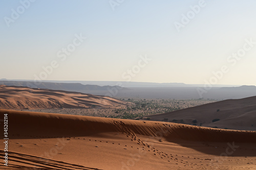 Dry lake (oasis) in Saudi Arabia near Riyadh city called Khararah Lake in the middle of the red sand desert.