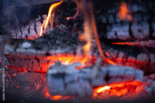 campfire flames and embers close up