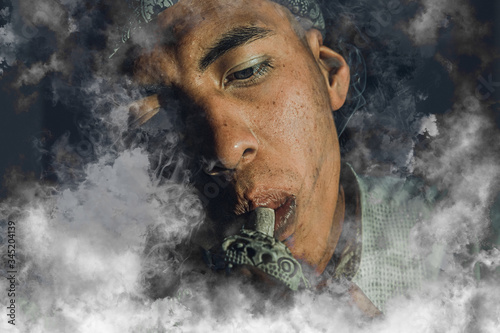 portrait of latin man smoking pot looking to the right