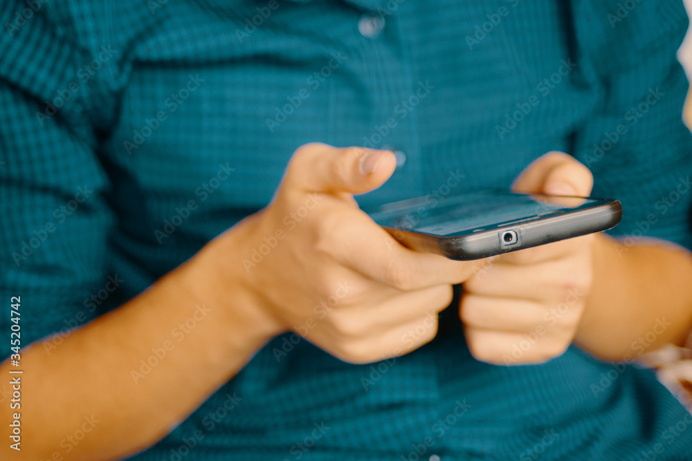 Close up of a man using mobile smartphone. Close up of a man using mobile smartphone.