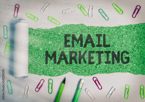 Writing note showing Email Marketing. Business concept for Sending a commercial message to a group of showing using mail photo