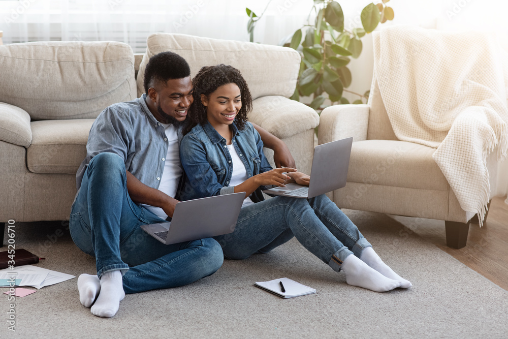Remote Work. Black Couple Using Laptops At Home, Working Online Together Remote Work. Black Couple Using Laptops At Home, Working Online Together