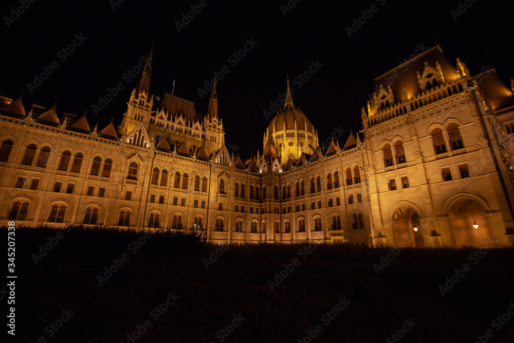 Obraz premium Hungarian Parliament building in the city of Budapest. Budapest at night time. A sample of neo-gothic architecture, Budapest tourist attraction