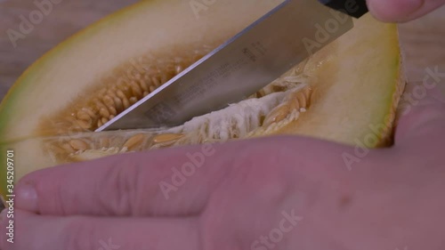 Cutting Half a Fresh Cantaloupe. Fruit, Exotic fruit