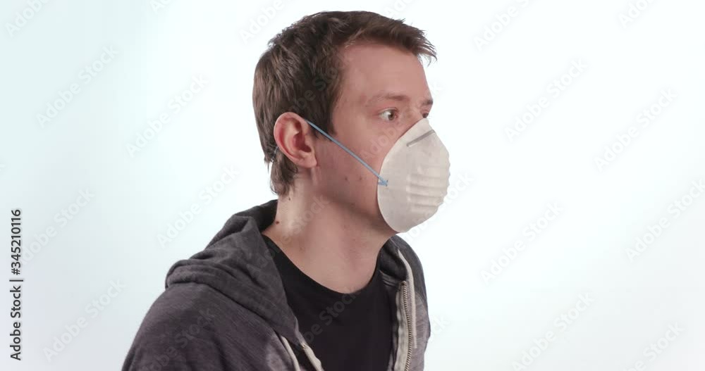 Male Wearing White Protective Face Mask PPE on White Background Male Wearing White Protective Face Mask PPE on White Background