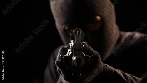 The Robber aiming rifle , terrorist mass shooting . photo