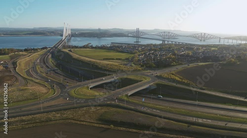 Drone shot of the 3 bridges in South Queensferry - Forth rail bridge, Queensferry crossing and Forth Road Bridge,