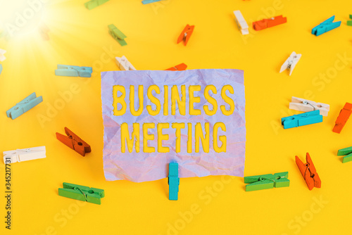 Word writing text Business Meeting. Business photo showcasing used discuss issues that cannot be addressed in simple way Colored clothespin papers empty reminder yellow floor background office photo