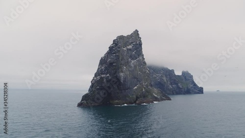 Aerial shot of Boreray, stac armin and stac lee, St Kilda, Scotland during sunset photo