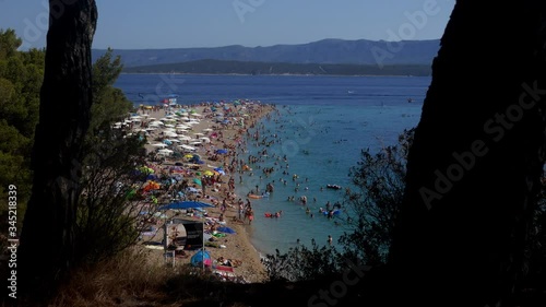 Wallpaper Mural Crowd of people relaxing sunbathing and swimming in Zlatni rat golden horn beach Torontodigital.ca
