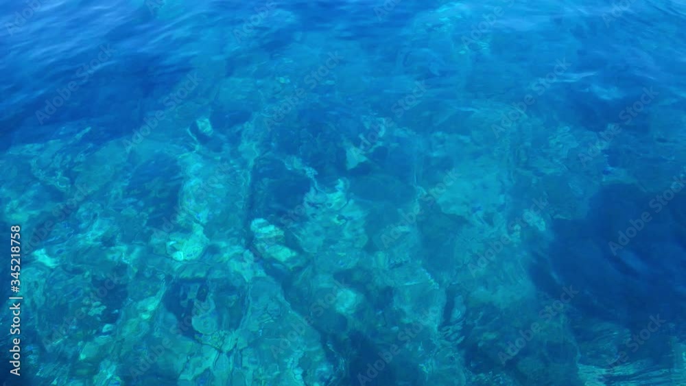 POV Looking at underwater reefs at a crystal clear turquoise sea waters POV Looking at underwater reefs at a crystal clear turquoise sea waters