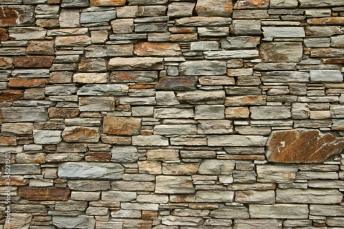 Obraz na plátne Natural background pattern, Otago schist stone wall, rugged grunge stone texture
