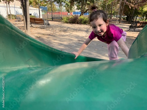 little girl on a swing