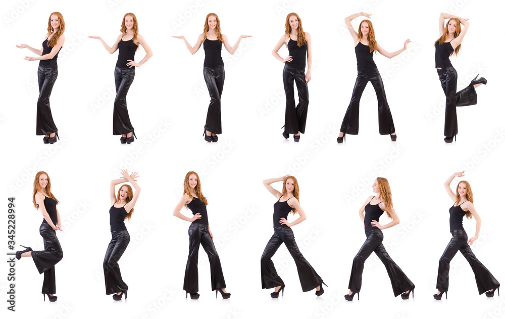 Fototapeta premium Redhead woman in black bell bottom pants on white