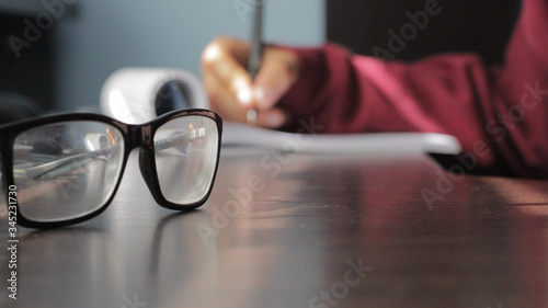 man reading a book with glasses

