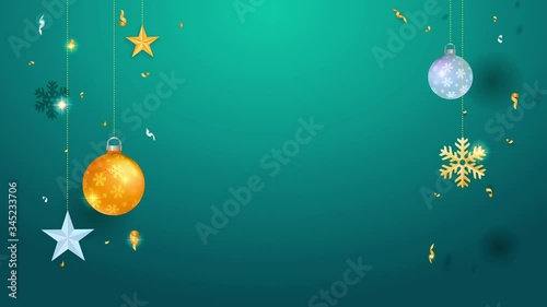 golden and silver tree bulbs stars snowflakes and confetti hanging on the sides of turquoise background leaving space for text for christmas season