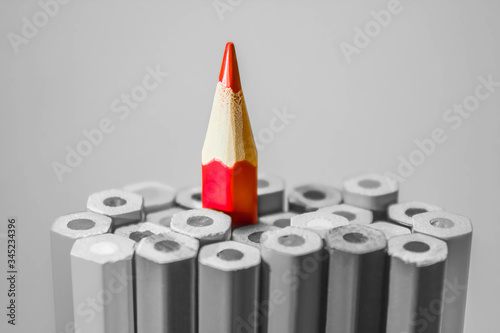 Obraz na plátně Red pencil stand out on black white background