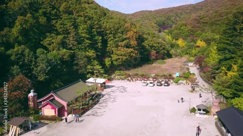 Aerial video of Wawoojeongsa temple during Autumn season, South Korea. Aerial landscape of Autumn in South Korea. photo
