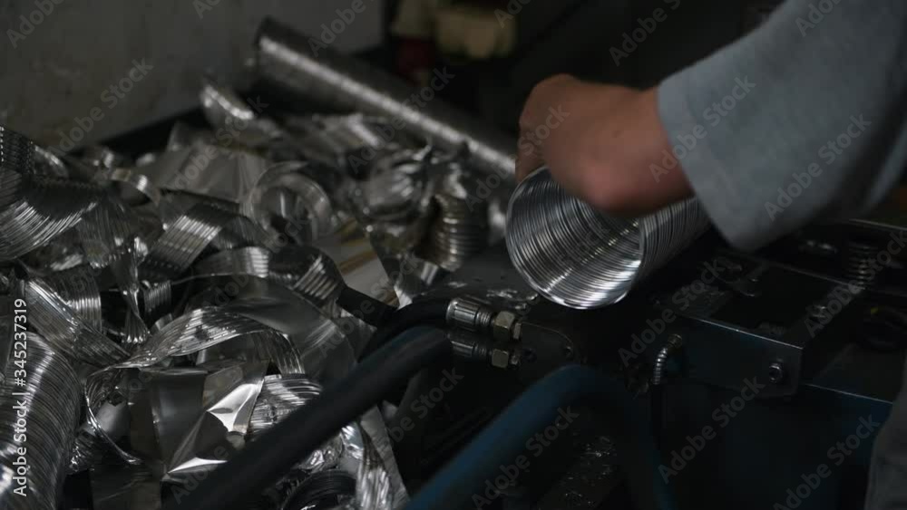 Process of manufacturing ventilation pipe in the metal factory. Process of manufacturing ventilation pipe in the metal factory.