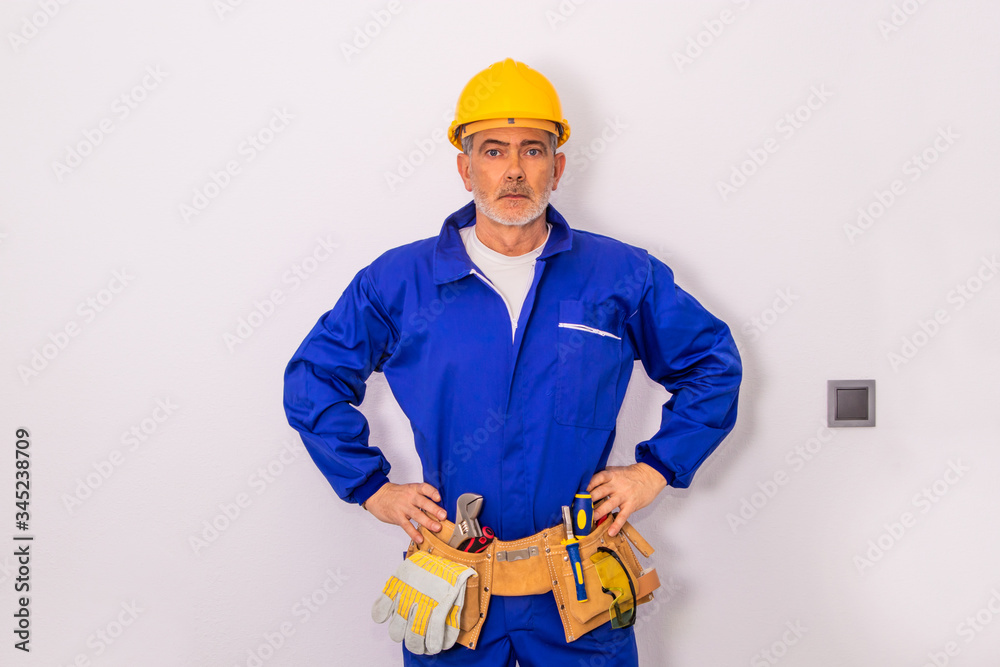 construction worker or professional man with tools and helmet